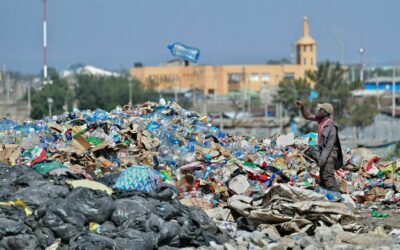 A waste picker sorts through plastic bottle waste at the Dandora garbage dump where people scavenge through the landfill for re-usables and recyclables that can be re-sold in Nairobi on February 26, 2022. More than 100 nations convening in Nairobi next week for the Fifth Session of the United Nations Environment Assembly,(UNEA-5), at the United Nations Environment Programme (UNEP) Headquarters in Nairobi, expected to take the first steps toward establishing a historic global treaty to tackle the plastic crisis afflicting the planet (Photo by Tony KARUMBA / AFP) (Photo by TONY KARUMBA/AFP via Getty Images)